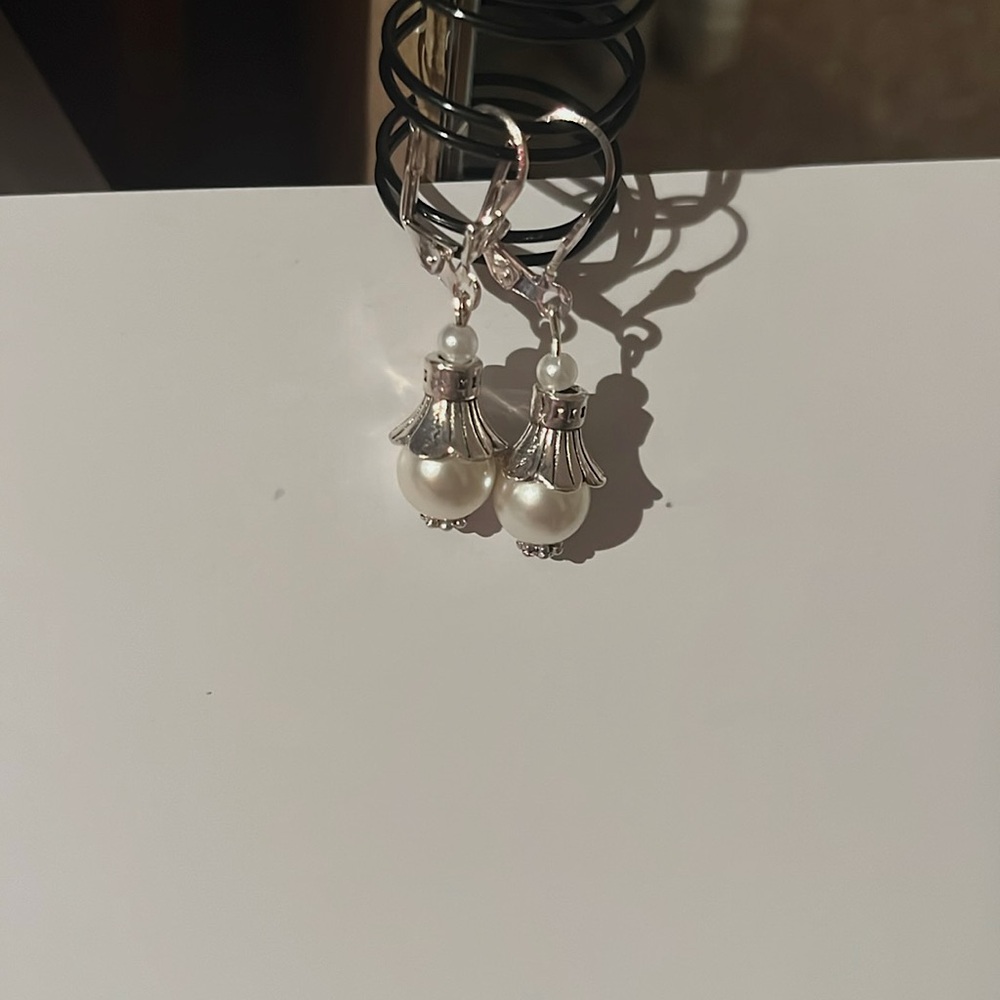Dangly pearl earring with bead covers. Silver clasps